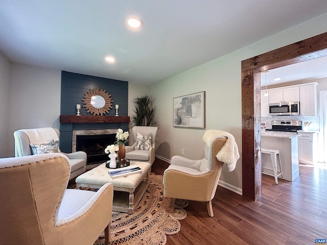 1203 Afton Mountain Rd, Afton, VA 22920 - living area featuring wood finished floors, a brick fireplace, and recessed lighting