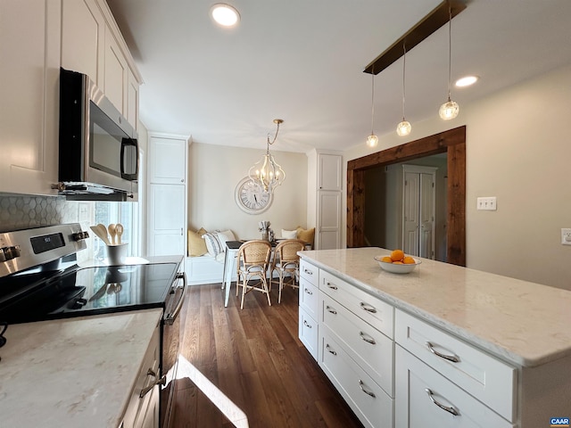 1203 Afton Mountain Rd, Afton, VA 22920 - kitchen featuring appliances with stainless steel finishes, white cabinets, decorative backsplash, a chandelier, and hanging light fixtures
