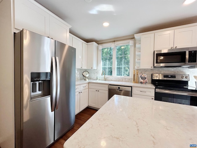 1203 Afton Mountain Rd, Afton, VA 22920 - kitchen with appliances with stainless steel finishes, dark wood-style floors, light stone counters, white cabinets, and recessed lighting