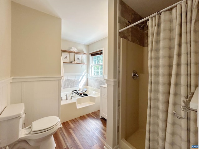 1203 Afton Mountain Rd, Afton, VA 22920 - bathroom featuring a stall shower, a bath, wainscoting, and wood finished floors