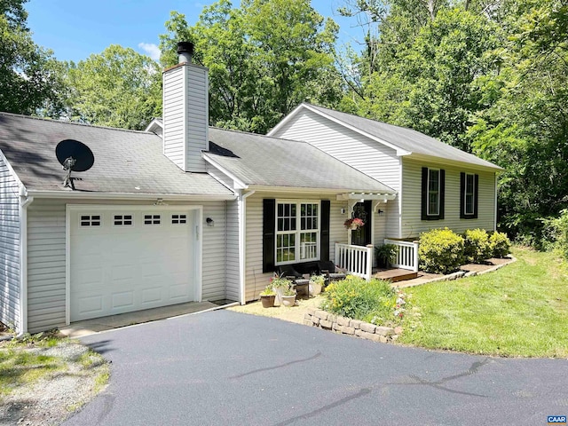 1203 Afton Mountain Rd, Afton, VA 22920 - tri-level home with an attached garage, driveway, and a chimney