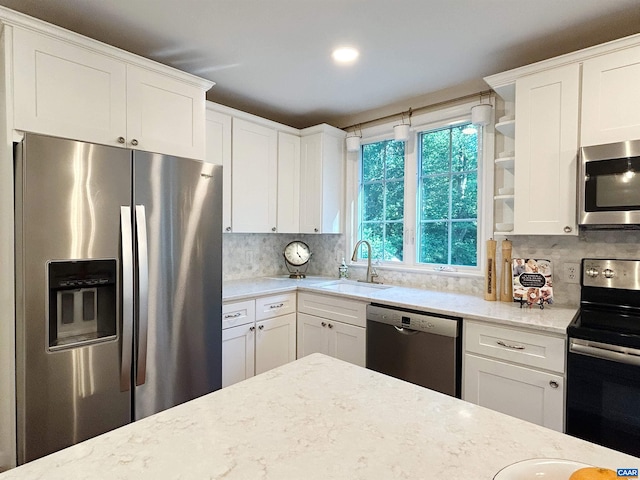 1203 Afton Mountain Rd, Afton, VA 22920 - kitchen with stainless steel appliances, light stone countertops, and white cabinets