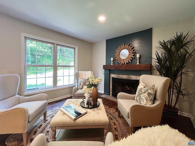 1203 Afton Mountain Rd, Afton, VA 22920 - sitting room with a brick fireplace, wood finished floors, and recessed lighting