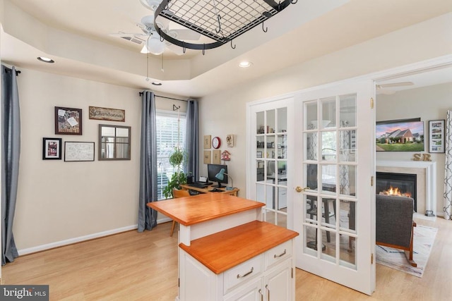 11200 Scottwood Ln N, Fredericksburg, VA 22407 - office featuring light wood-style floors, a ceiling fan, recessed lighting, a glass covered fireplace, and french doors
