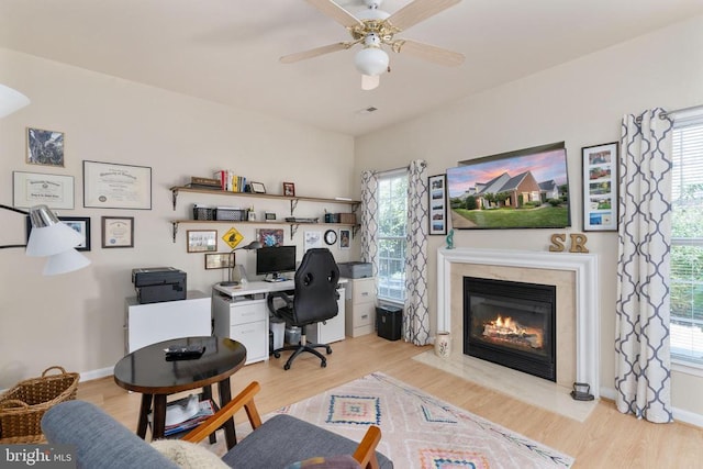 11200 Scottwood Ln N, Fredericksburg, VA 22407 - office with light wood finished floors, healthy amount of natural light, a fireplace, and ceiling fan