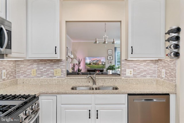 11200 Scottwood Ln N, Fredericksburg, VA 22407 - kitchen featuring stainless steel appliances, white cabinetry, tasteful backsplash, light stone countertops, and crown molding