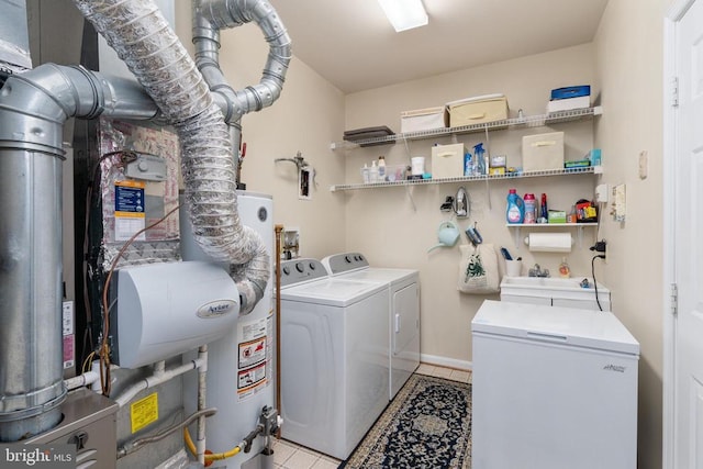 11200 Scottwood Ln N, Fredericksburg, VA 22407 - laundry area featuring independent washer and dryer, gas water heater, and light tile patterned floors