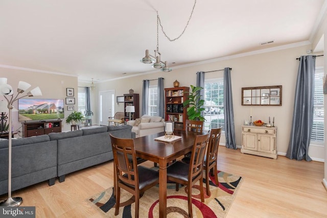 11200 Scottwood Ln N, Fredericksburg, VA 22407 - dining space with light wood-type flooring, ornamental molding, and a chandelier
