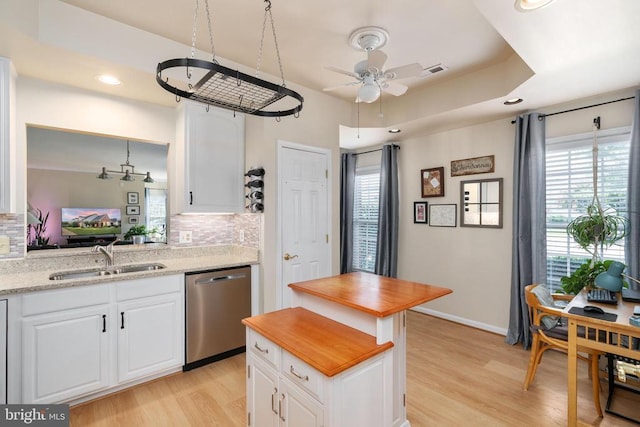11200 Scottwood Ln N, Fredericksburg, VA 22407 - kitchen with stainless steel dishwasher, tasteful backsplash, light wood finished floors, white cabinetry, and a ceiling fan