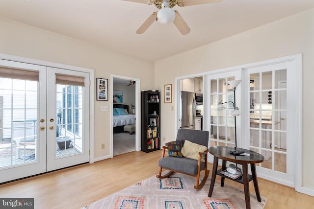 11200 Scottwood Ln N, Fredericksburg, VA 22407 - living area featuring french doors, light wood finished floors, and ceiling fan