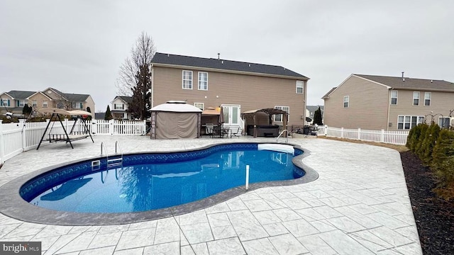 view of pool featuring a gazebo, a hot tub, and a patio