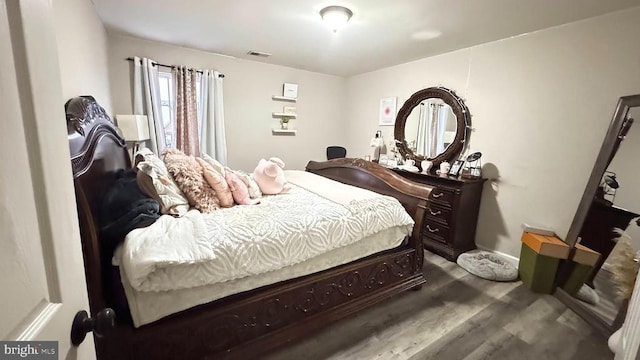 bedroom with wood-type flooring