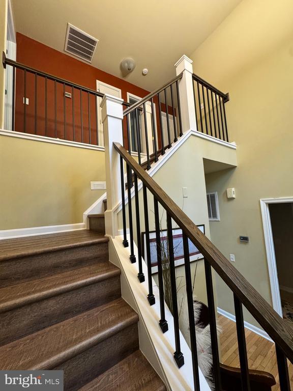 6609 Turkey Run Dr, Fredericksburg, VA 22407 - stairway featuring wood finished floors and baseboards