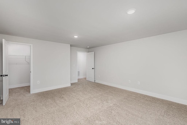 26437 Pennfields Dr, Orange, VA 22960 - unfurnished bedroom with light carpet, a walk in closet, recessed lighting, and baseboards