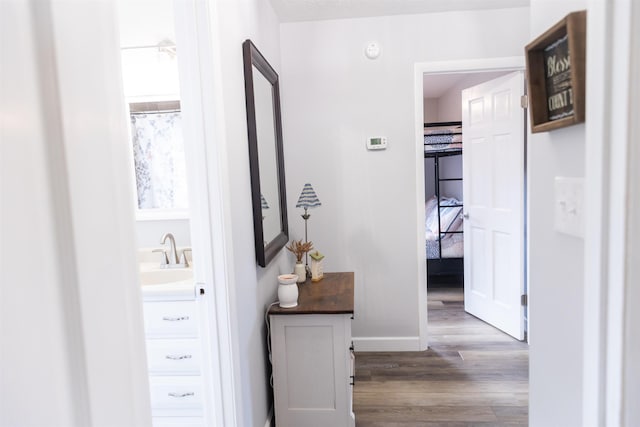 1014 22nd St E, Buena Vista, VA 24416 - hall featuring wood finished floors and a sink