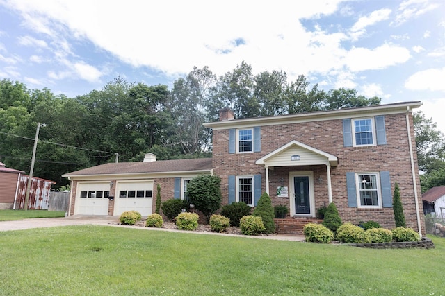 1014 22nd St E, Buena Vista, VA 24416 - view of front of property with a chimney, brick siding, a garage, and concrete driveway