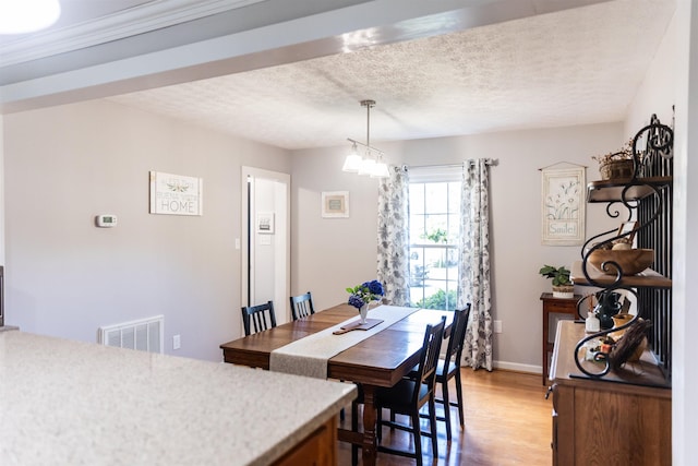 1014 22nd St E, Buena Vista, VA 24416 - dining area with a textured ceiling and light wood-style floors