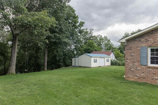 1014 22nd St E, Buena Vista, VA 24416 - view of green lawn featuring an outbuilding and view of scattered trees