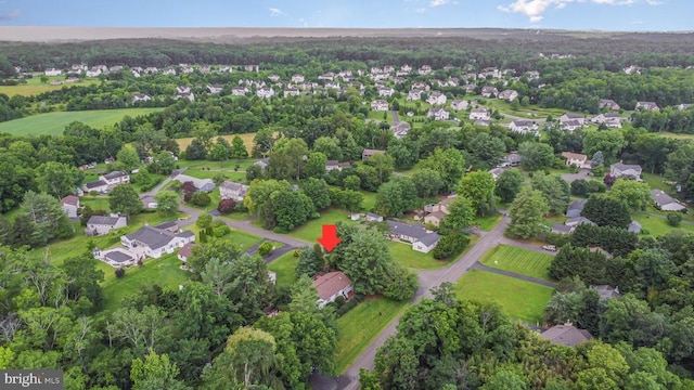  - aerial view of property and surrounding area with nearby suburban area