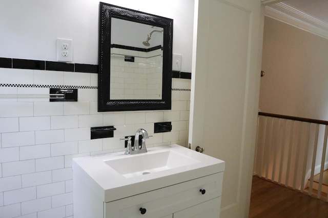645 Cherry Ave, Waynesboro, VA 22980 - bathroom featuring vanity, ornamental molding, wood finished floors, tile walls, and a shower