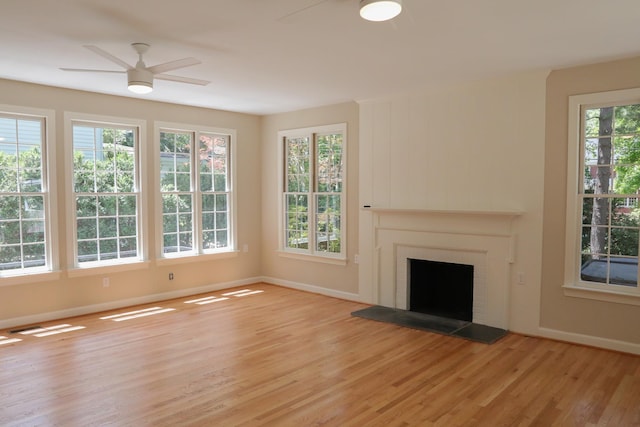 645 Cherry Ave, Waynesboro, VA 22980 - unfurnished living room with ceiling fan, light wood-style flooring, baseboards, and a fireplace