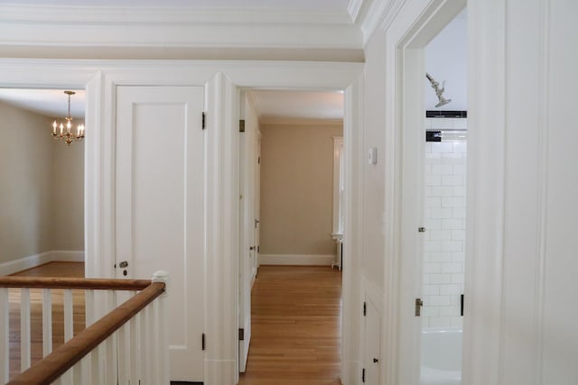 645 Cherry Ave, Waynesboro, VA 22980 - corridor with light wood-style floors, a chandelier, baseboards, and ornamental molding