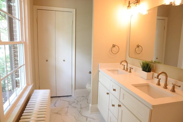 645 Cherry Ave, Waynesboro, VA 22980 - full bath with radiator heating unit, marble finish floors, double vanity, and plenty of natural light