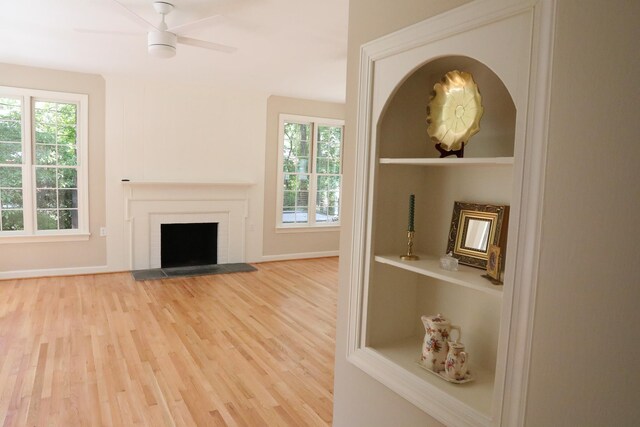 645 Cherry Ave, Waynesboro, VA 22980 - unfurnished living room featuring wood finished floors, a fireplace, a ceiling fan, and baseboards
