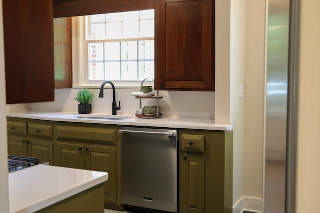 645 Cherry Ave, Waynesboro, VA 22980 - kitchen with stainless steel dishwasher, a sink, light countertops, and cooktop
