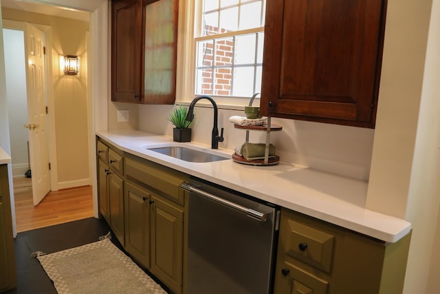 645 Cherry Ave, Waynesboro, VA 22980 - kitchen with a sink, stainless steel dishwasher, light countertops, and dark wood finished floors