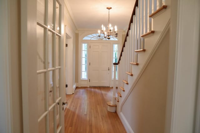 645 Cherry Ave, Waynesboro, VA 22980 - foyer featuring light wood-style floors, stairway, crown molding, a chandelier, and baseboards