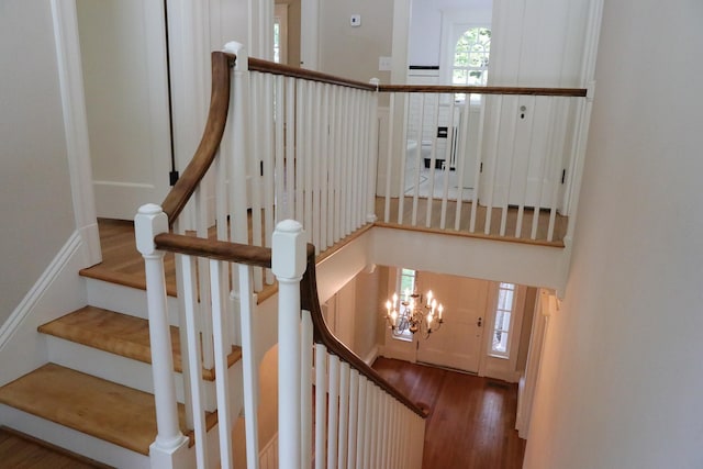 645 Cherry Ave, Waynesboro, VA 22980 - staircase with wood finished floors and a chandelier