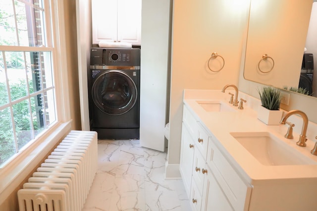 645 Cherry Ave, Waynesboro, VA 22980 - washroom with washer / clothes dryer, radiator, light marble finish flooring, and cabinet space