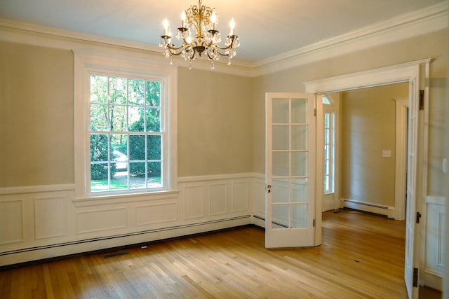 645 Cherry Ave, Waynesboro, VA 22980 - unfurnished dining area with a baseboard radiator, light wood-style floors, a chandelier, wainscoting, and ornamental molding