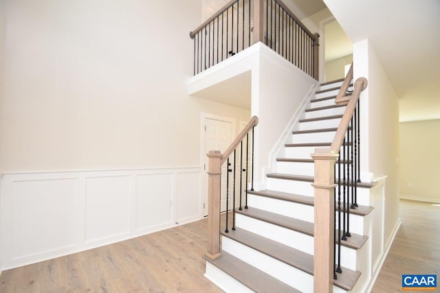 219 Riva Way, Palmyra, VA 22963 - stairs with wood finished floors, a wainscoted wall, and a decorative wall