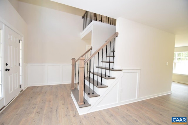 219 Riva Way, Palmyra, VA 22963 - entryway with wood finished floors, stairway, wainscoting, and a decorative wall
