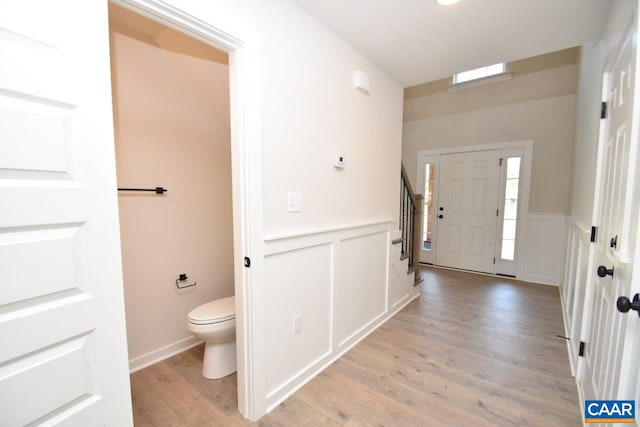 219 Riva Way, Palmyra, VA 22963 - foyer entrance with stairs, light wood-style flooring, wainscoting, and a decorative wall