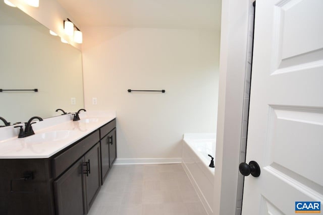 219 Riva Way, Palmyra, VA 22963 - full bath with baseboards, double vanity, and a bathtub