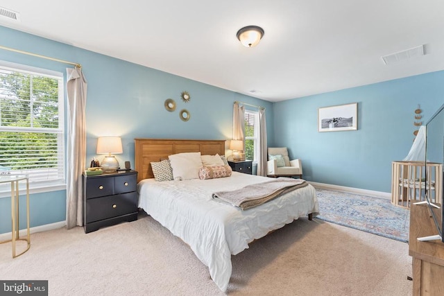 carpeted bedroom featuring baseboards
