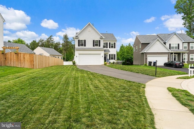 view of front facade with asphalt driveway and an attached garage