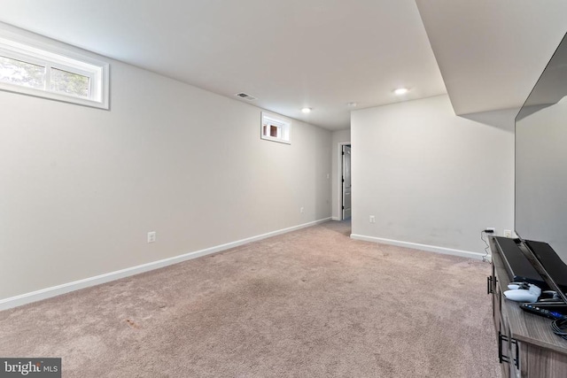 basement with light colored carpet, baseboards, and recessed lighting