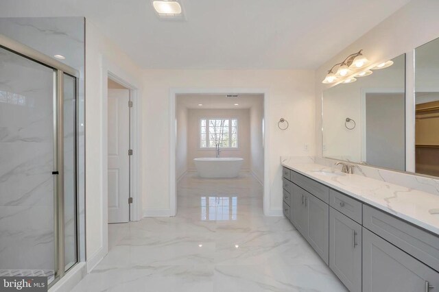  - full bath with a marble finish shower, marble finish flooring, a freestanding tub, and baseboards