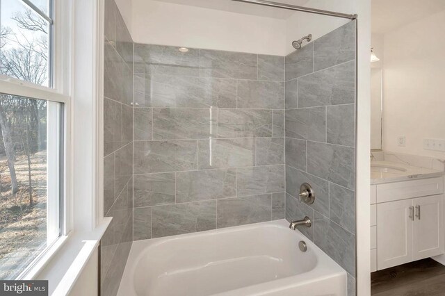  - bathroom featuring shower / tub combination and vanity