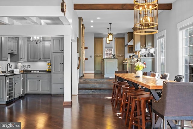 93 Tyro Ln, Roseland, VA 22967 - dining room with a chandelier, beamed ceiling, dark wood-style floors, beverage cooler, and baseboards