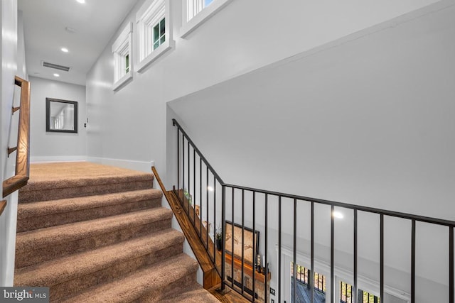 93 Tyro Ln, Roseland, VA 22967 - staircase with a towering ceiling, plenty of natural light, recessed lighting, baseboards, and carpet flooring