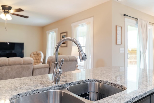 375 Mesa Ct, Broadway, VA 22815 - kitchen view of light stone countertops and a ceiling fan