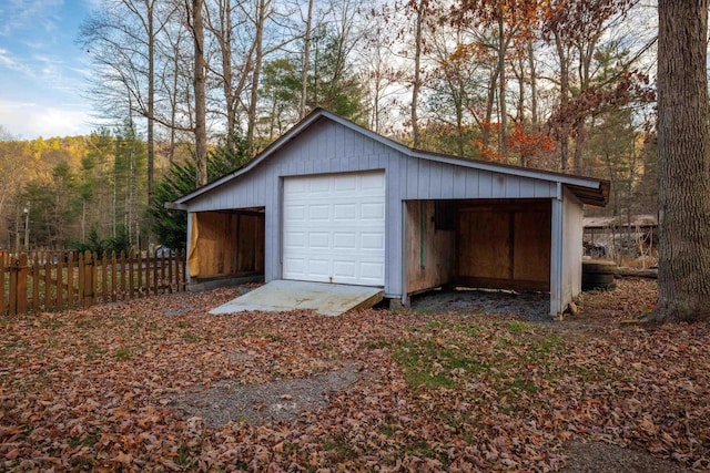 9871 Briery Branch Rd, Dayton, VA 22821 - garage with fence, a detached garage, and a wooded view