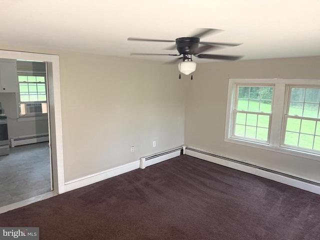  - empty room featuring a baseboard heating unit, ceiling fan, healthy amount of natural light, and dark carpet
