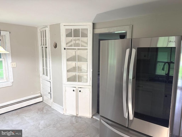  - kitchen featuring freestanding refrigerator and baseboard heating