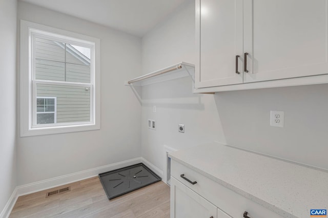 10A Sablewood Dr, Charlottesville, VA 22911 - washroom with hookup for an electric dryer, washer hookup, light wood finished floors, baseboards, and cabinet space